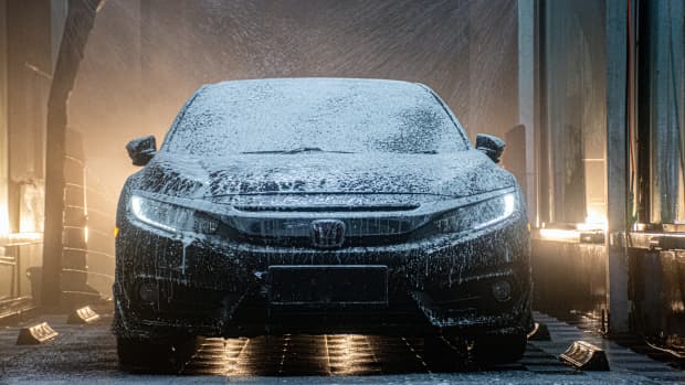 A car driving through an automated car wash