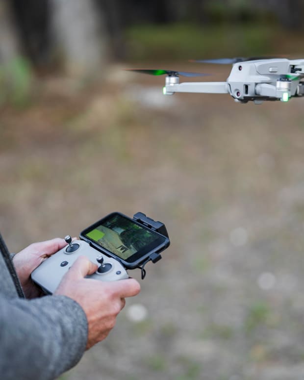 Pilot flying drone through radio-controlled handset