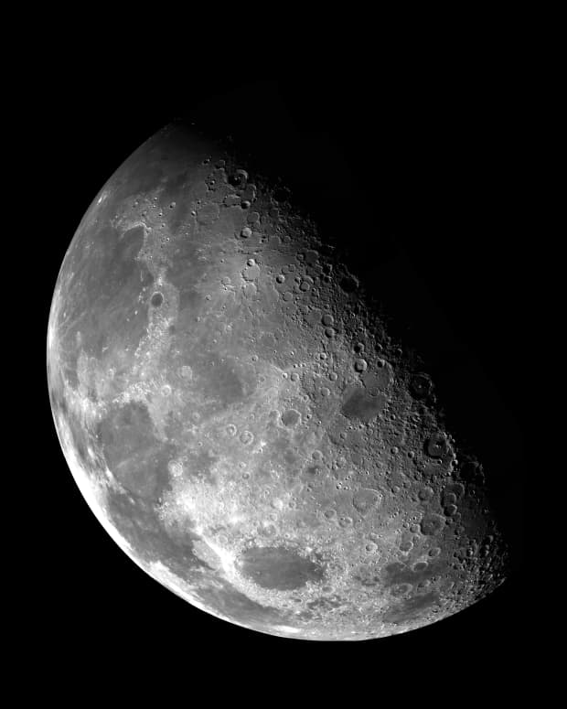 The contrast of shadow and light reveals craters on the Moon.