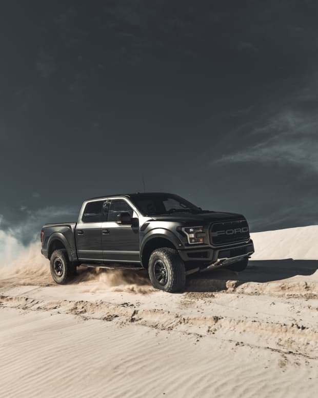 Pickup truck in sand.