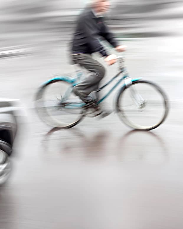 Bicycle in front of car.