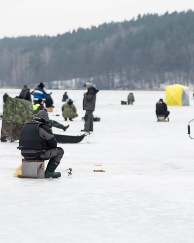 People ice fishing.