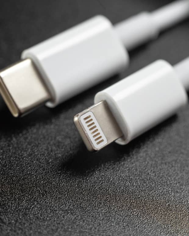 A USB-C cable next to an Apple Lightning cable.