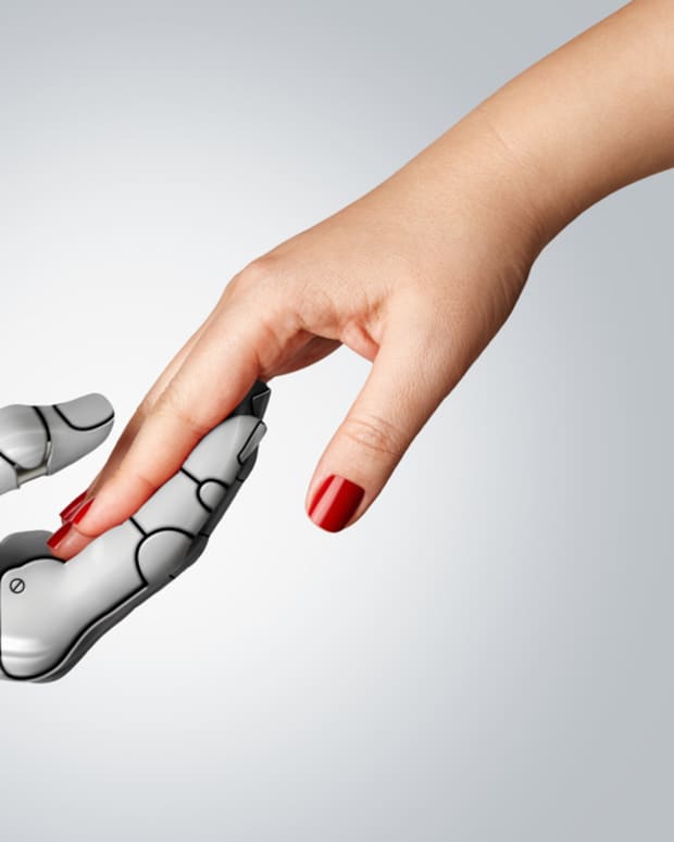 Robot hand holding human hand