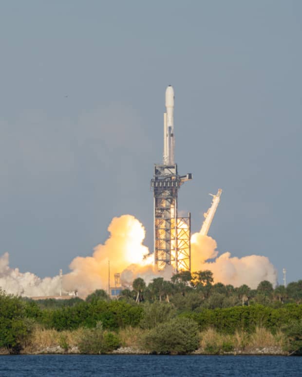 A SpaceX Falcon Heavy rocket blasting off