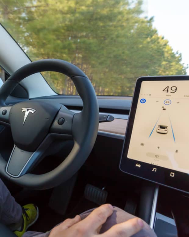 A Tesla car using Autopilot autonomous driving